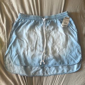 Size Small Jean skirt with drew string. Never worn